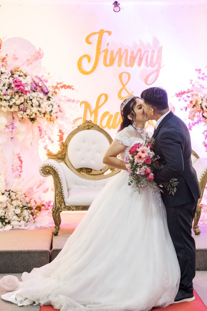 Jimmy and Maureen Wedding, Cebu Wedding Photographer, Portraits by Bukool, Cebu Archdiocesan Shrine of Saint Pedro Calungsod, Golden Peak Hotel Wedding, bride and groom reception kiss